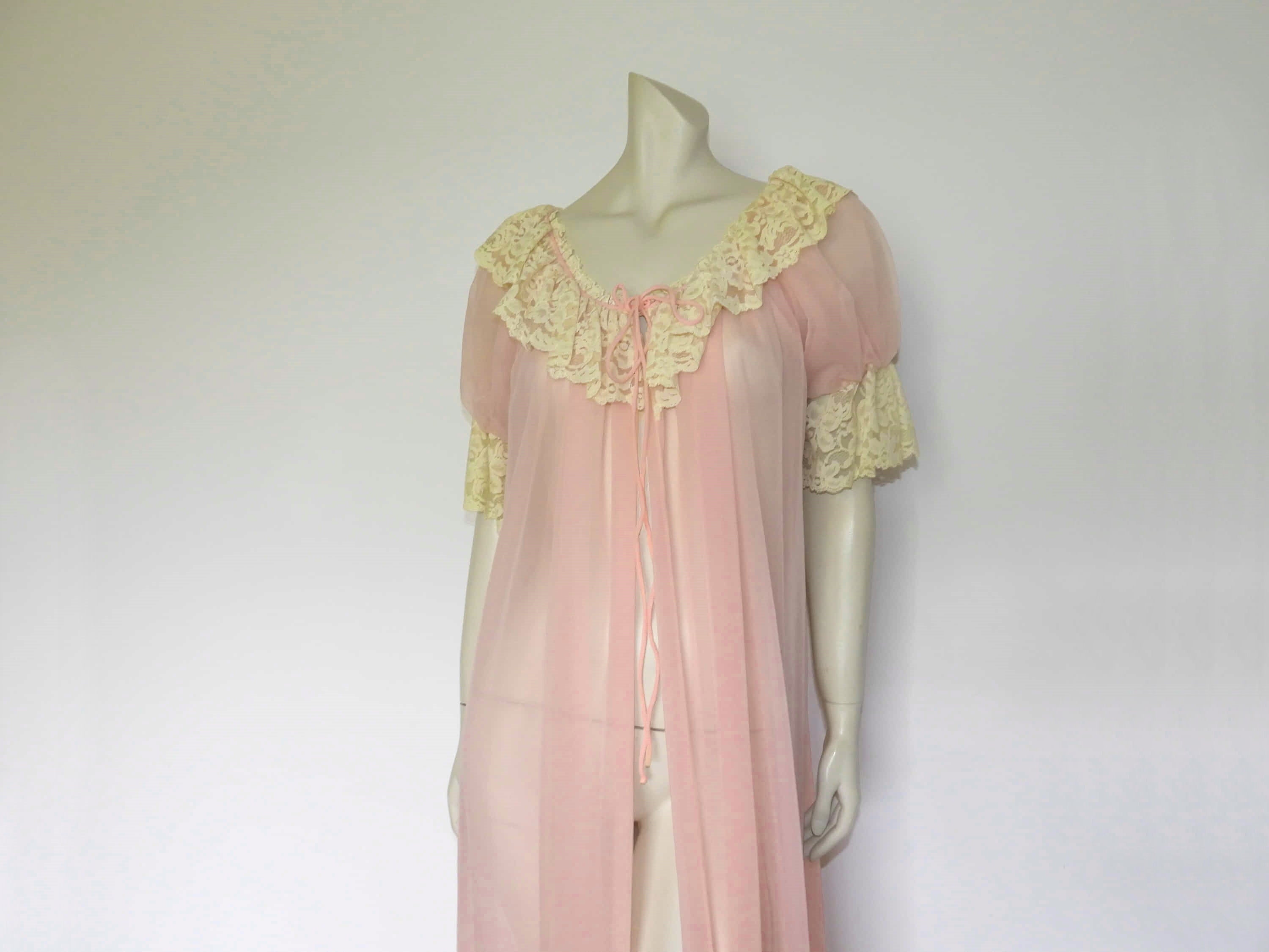 1960s vintage pink nylon peignoir negligee with puff sleeves and cream lace