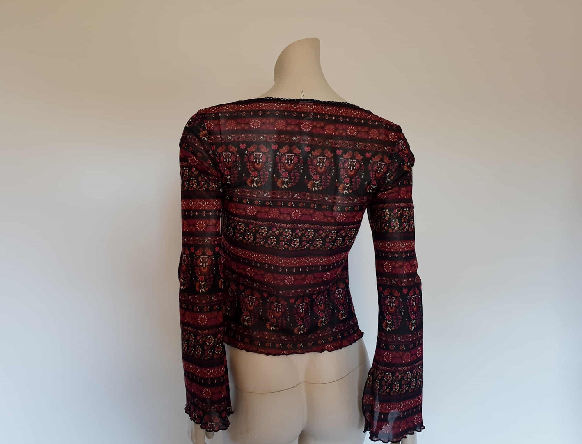 1990s vintage burgundy and black floral laced front top with flared and slashed sleeves