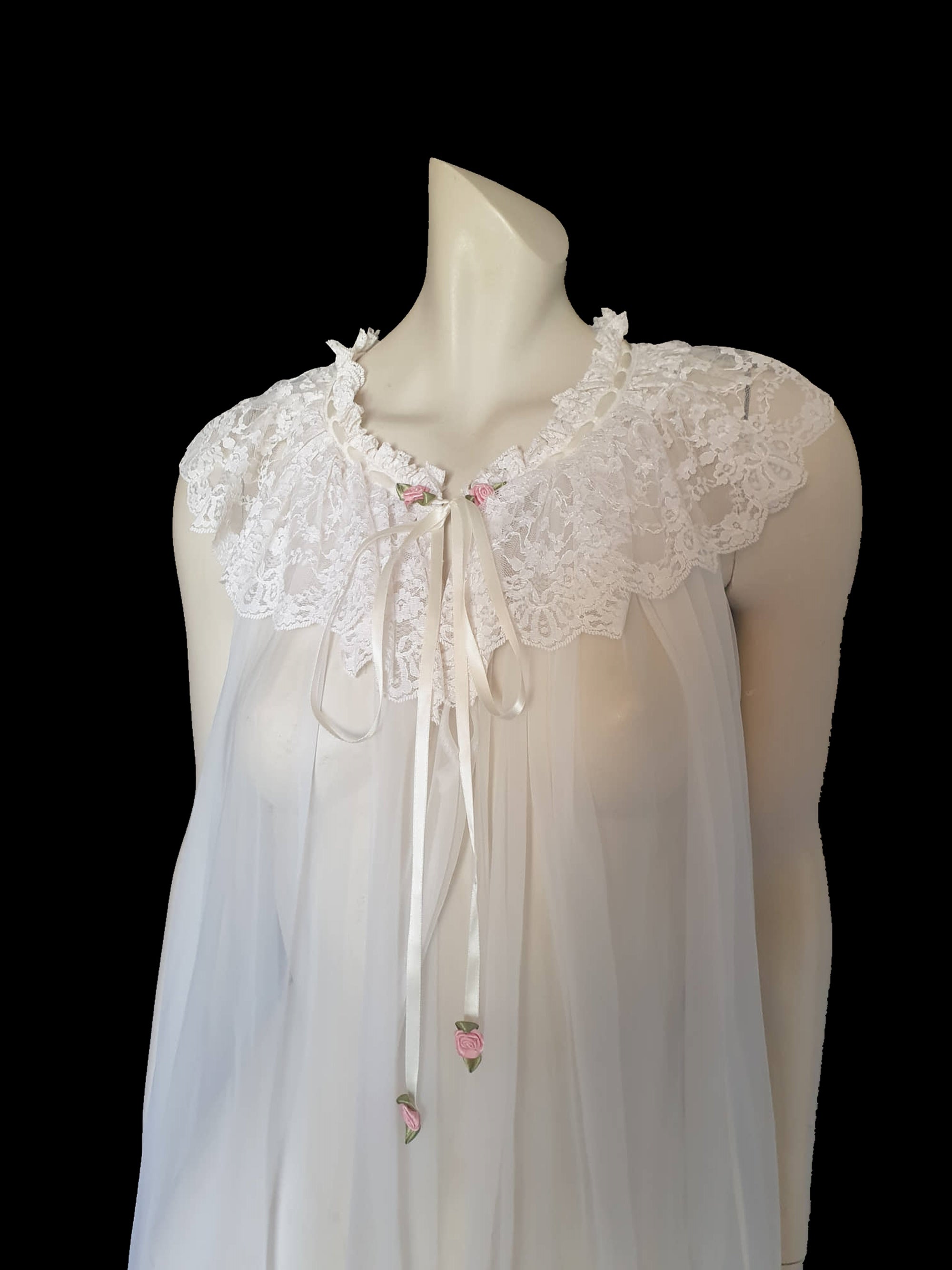 vintage sheer white negligee nightgown with lace ruffles and pink ribbon rosettes
