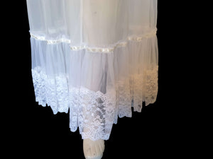 vintage sheer white negligee nightgown with lace ruffles and pink ribbon rosettes