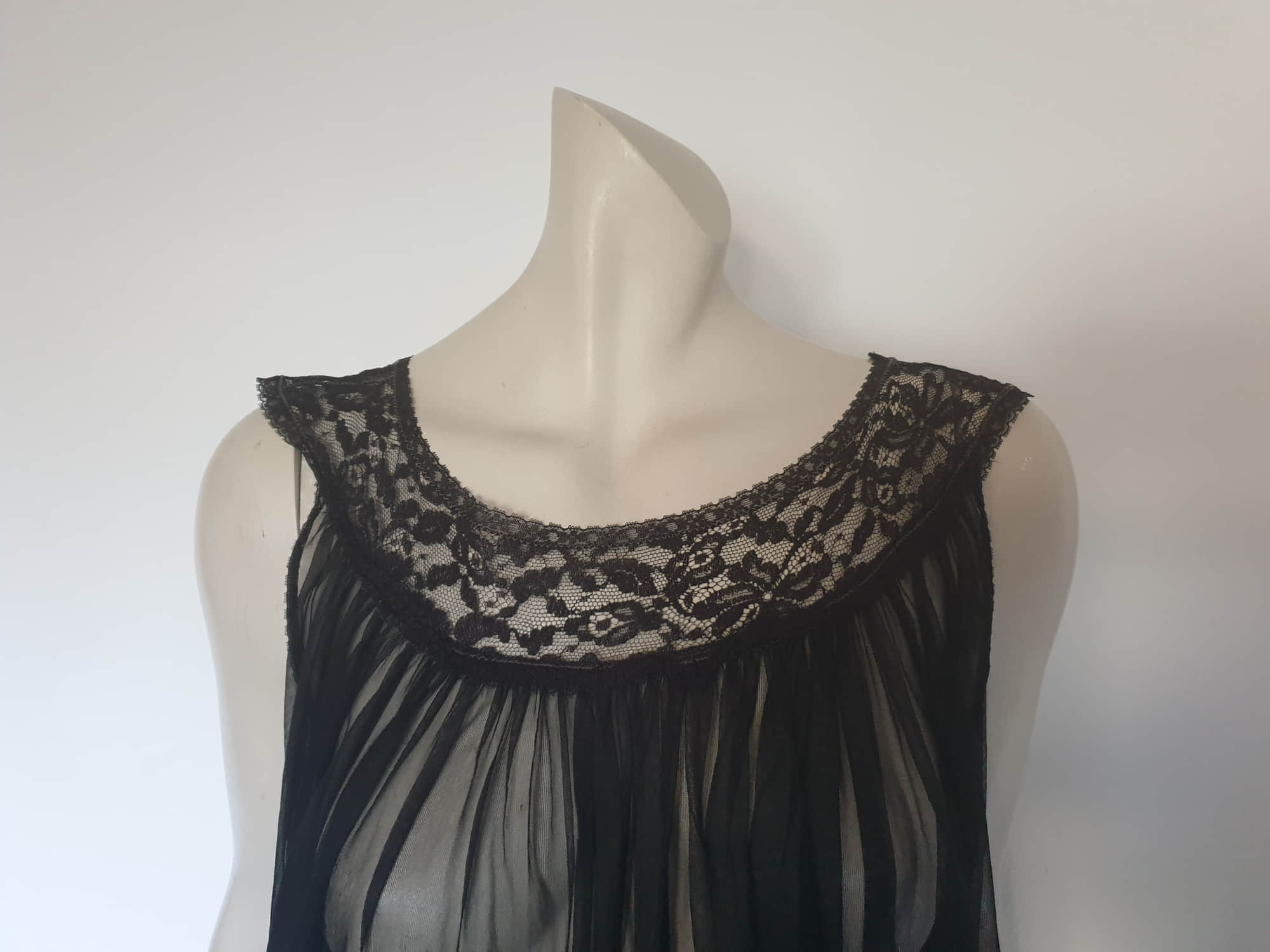 1950s vintage sheer black nightgown on a circular lace yoke