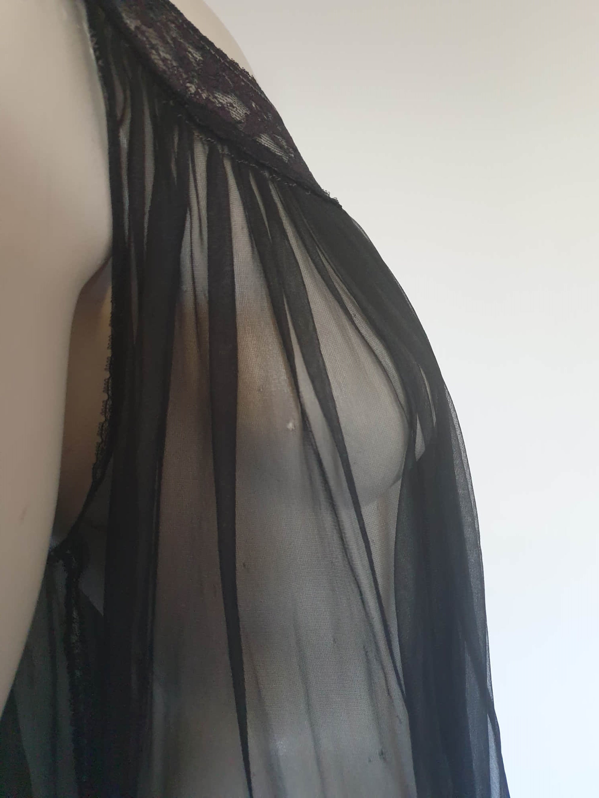 1950s vintage sheer black nightgown on a circular lace yoke