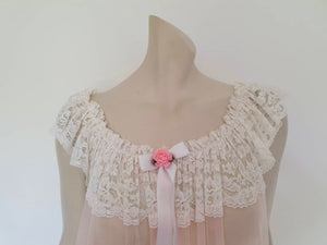 sheer vintage pale pink negligee nightgown with wide lace ruffles and short train
