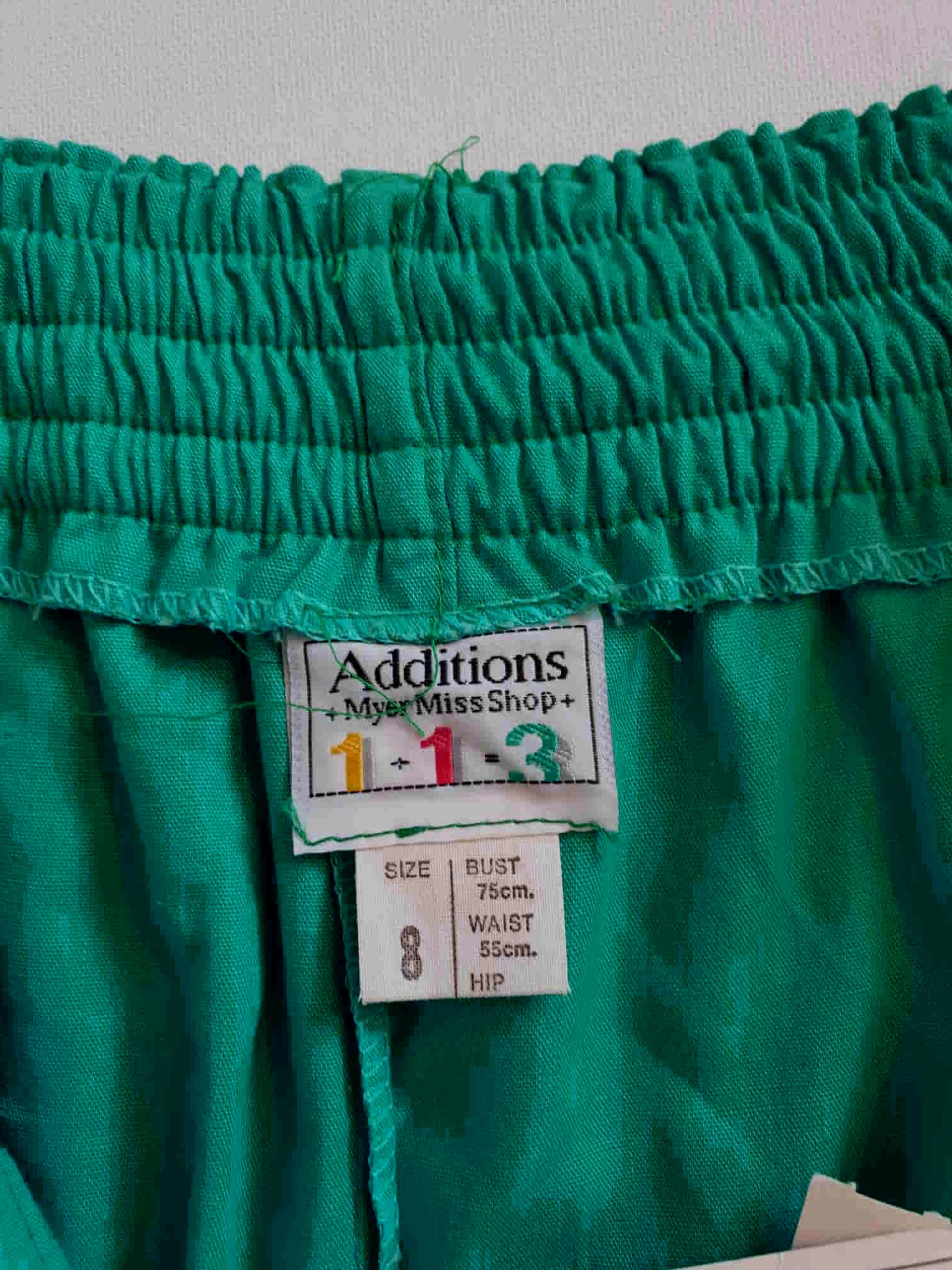 vintage 1980s baggy pants with tapered legs in jade green. New old stock.
