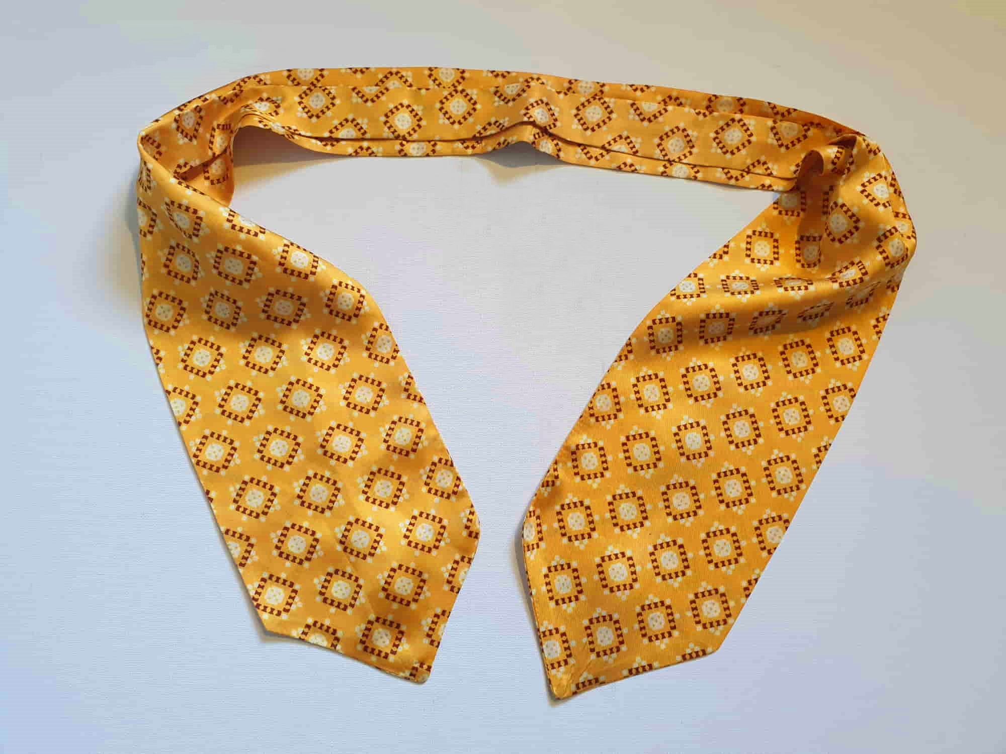 Vintage deep yellow cravat or ascot with brown and white medallions, Rayon, by Vogue of Sydney