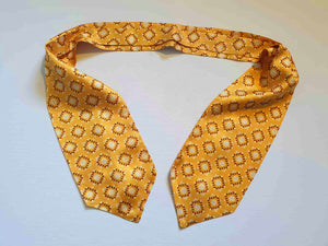 Vintage deep yellow cravat or ascot with brown and white medallions, Rayon, by Vogue of Sydney