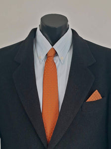 Burnt orange tie and pocket square set for a pop of colour. 
Brocade set - The fabric is woven to show a matt background and shiny medallion designs. 100% polyester. Brand is Vogue of Sydney - 1960s.