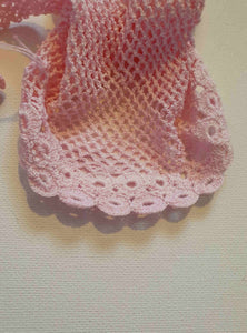 New Old Stock - Pink fingerless gloves or mitts crocheted in cotton. The top is open for four fingers, not separate finger sections apart from the thumb. Made in China. From a former bridal store operating in the 1980s.