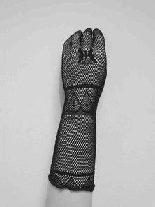 New old stock.
Goth style Super stretchy black mesh gloves feature a butterfly design on the back of the hand. Fabric is nylon. Made in China. Brand is Profile. Unsold stock from a 1980s bridal boutique.