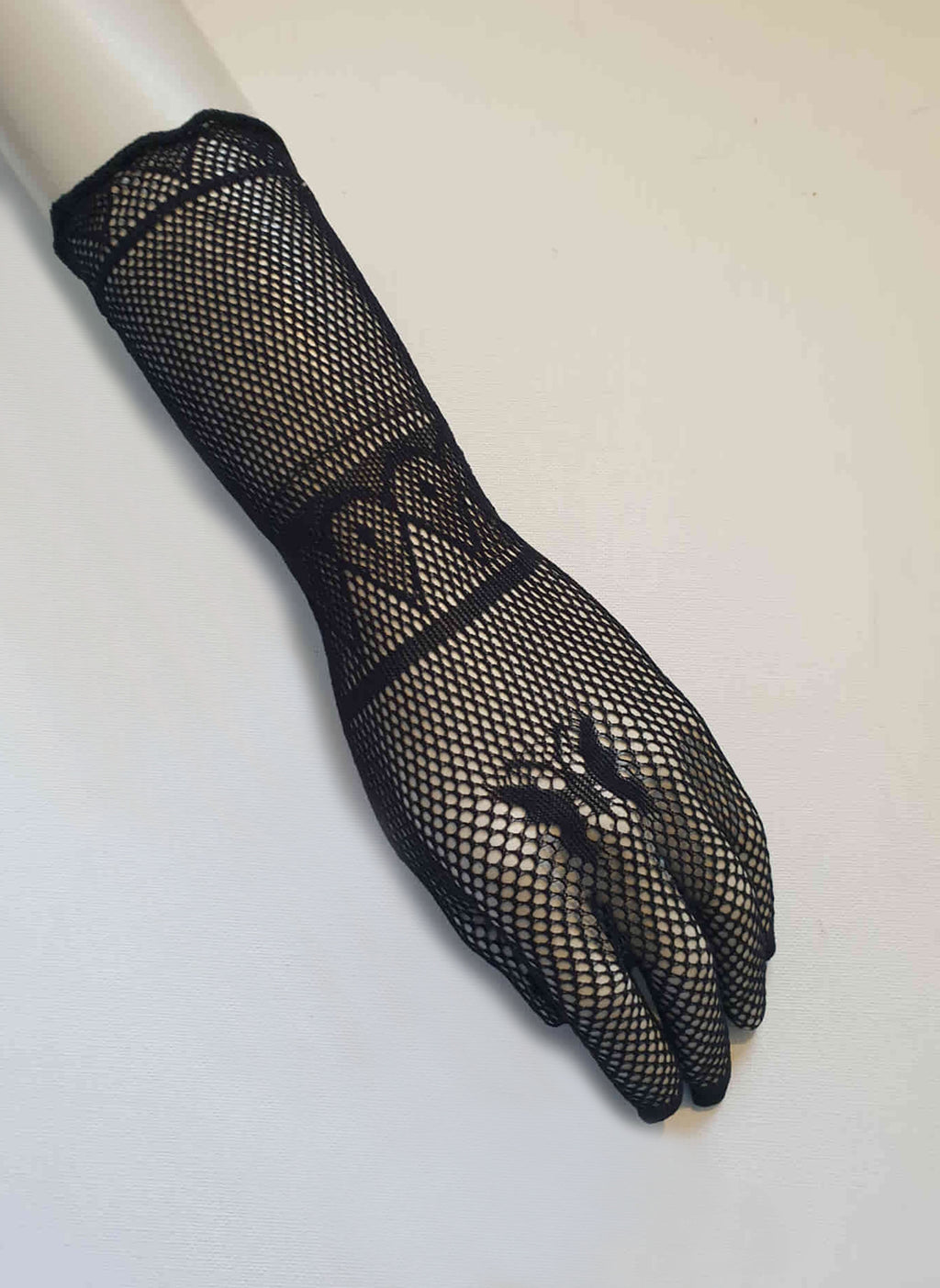 New old stock.
Goth style Super stretchy black mesh gloves feature a butterfly design on the back of the hand. Fabric is nylon. Made in China. Brand is Profile. Unsold stock from a 1980s bridal boutique.