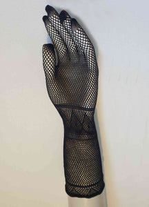 New old stock.
Goth style Super stretchy black mesh gloves feature a butterfly design on the back of the hand. Fabric is nylon. Made in China. Brand is Profile. Unsold stock from a 1980s bridal boutique.