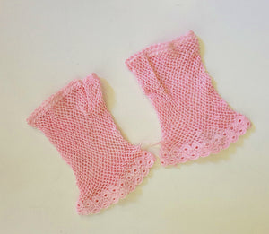 New Old Stock - Pink fingerless gloves or mitts crocheted in cotton. The top is open for four fingers, not separate finger sections apart from the thumb. Made in China. From a former bridal store operating in the 1980s.