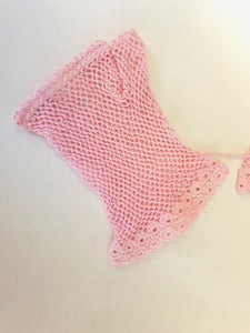 New Old Stock - Pink fingerless gloves or mitts crocheted in cotton. The top is open for four fingers, not separate finger sections apart from the thumb. Made in China. From a former bridal store operating in the 1980s.