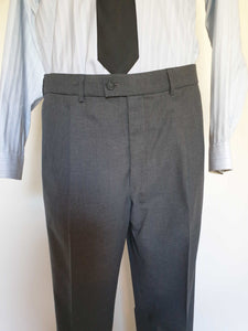 The suit jacket has notched lapels, flapped pockets, breast pocket, two button closure, three button sleeve trim and three interior pockets. It has two rear vents.
The vest has two pockets and five button closure. There is no belt for rear adjustment.
The trousers have straight legs, two front pleats at the waist, two diagonal side pockets, coin pocket and two buttoning rear pockets. 
The fabric is 80% wool, 20% polyester. Made by the iconic Fletcher Jones Australia. Conveniently dated 1-5-1990. Size 117R.