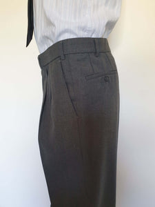 The suit jacket has notched lapels, flapped pockets, breast pocket, two button closure, three button sleeve trim and three interior pockets. It has two rear vents.
The vest has two pockets and five button closure. There is no belt for rear adjustment.
The trousers have straight legs, two front pleats at the waist, two diagonal side pockets, coin pocket and two buttoning rear pockets. 
The fabric is 80% wool, 20% polyester. Made by the iconic Fletcher Jones Australia. Conveniently dated 1-5-1990. Size 117R.