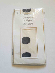 Make a statement with these Superblob tights by luxury hosiery brand Jonathan Aston. Sheer white pantyhose/tights with very large black polka dots. 100% nylon. Made in England - 1980s. Fits 163-180 cm/59-75 kg (5'4"-5'9"/130-165 lbs.) New old stock, in the original packaging, unworn.