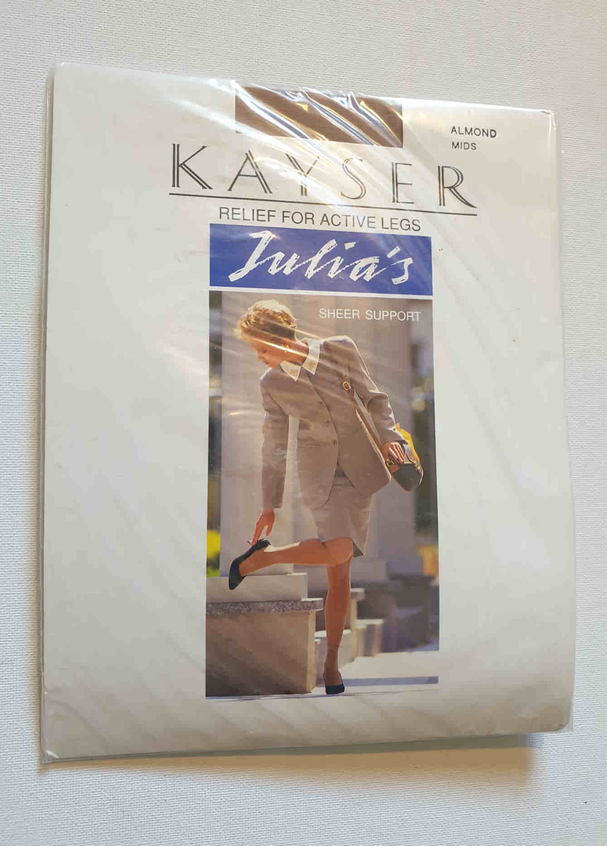 New old stock vintage pantyhose. All over sheer support - relief for active legs. "From waist to toe - gentle support follows your every contour." Cotton gusset and reinforced toe. Colour is Almond - a light beige, skin tone. Brand is Julia's by Kayser - 1980s or early 1990s. Size - Mids