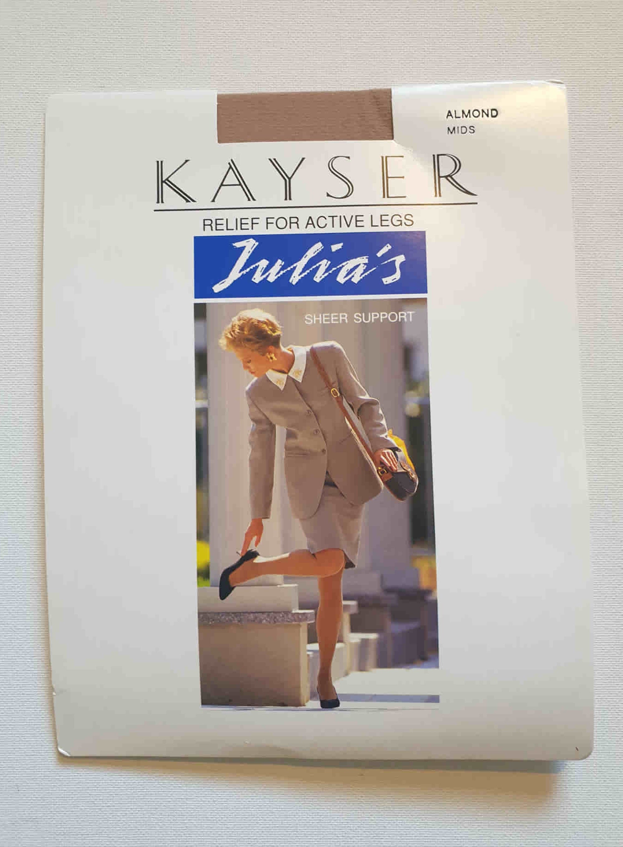 New old stock vintage pantyhose. All over sheer support - relief for active legs. "From waist to toe - gentle support follows your every contour." Cotton gusset and reinforced toe. Colour is Almond - a light beige, skin tone. Brand is Julia's by Kayser - 1980s or early 1990s. Size - Mids