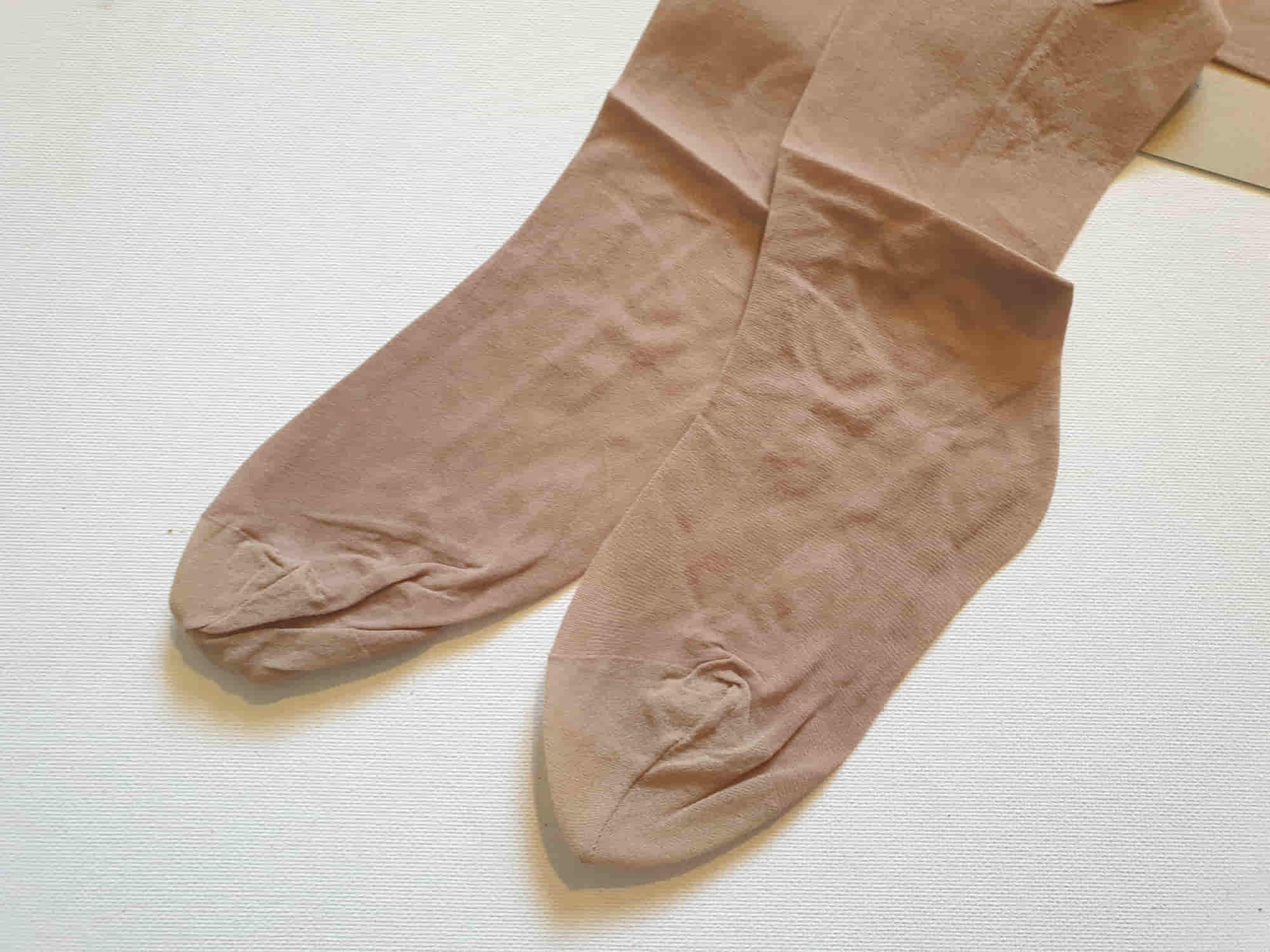 New old stock vintage pantyhose. All over sheer support - relief for active legs. "From waist to toe - gentle support follows your every contour." Cotton gusset and reinforced toe. Colour is Almond - a light beige, skin tone. Brand is Julia's by Kayser - 1980s or early 1990s. Size - Mids