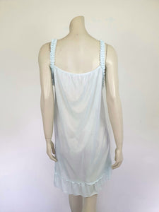 Pretty above knee length blue nightgown has ruffled straps and armholes, lace bodice and front bow. Ruffle at the hemline. Fabric is nylon. No brand label. Made in China. 1980s-1990s.