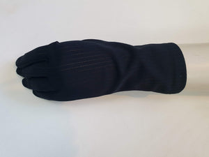 Smart black gloves for a classic dressed up look. Below wrist length stretch gloves have a striped pattern in the weave with a tiny transparent line, giving the look of a line of fine scoring. Mid weight. Fabric is nylon. No brand tag - 1960s. Large.