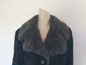 Fabulous little faux fur mini coat, just the thing that Twiggy might have worn. Black synthetic fur coat has a large fluffy grey collar and hem band. It has two side seam pockets and a matching tie running through carriers at the waist. Bound buttonholes. I have added three vintage metal buttons as the originals were missing. Fully lined with rayon or acetate. No labels at all - 1960s. Small.