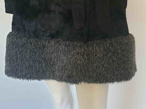 Fabulous little faux fur mini coat, just the thing that Twiggy might have worn. Black synthetic fur coat has a large fluffy grey collar and hem band. It has two side seam pockets and a matching tie running through carriers at the waist. Bound buttonholes. I have added three vintage metal buttons as the originals were missing. Fully lined with rayon or acetate. No labels at all - 1960s. Small.