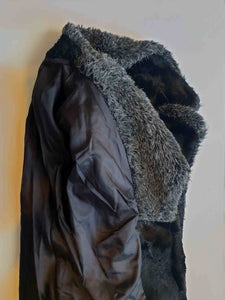 Fabulous little faux fur mini coat, just the thing that Twiggy might have worn. Black synthetic fur coat has a large fluffy grey collar and hem band. It has two side seam pockets and a matching tie running through carriers at the waist. Bound buttonholes. I have added three vintage metal buttons as the originals were missing. Fully lined with rayon or acetate. No labels at all - 1960s. Small.