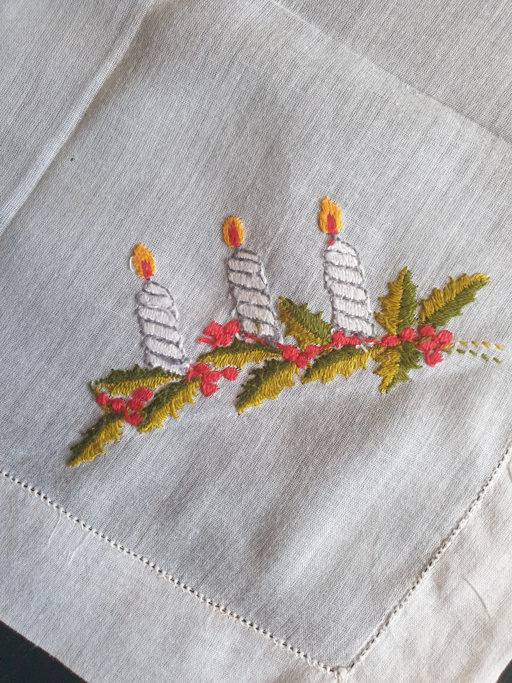 Beautiful hand embroidered Christmas handkerchief, probably made as a Christmas present at least 70 years ago. Three candles and holly leaves beautifully worked on this very fine cotton batiste hanky. If you look at the reverse side in the last photo, it's almost as neat as the front, a sign of superior needlework. The edges have been hem stitched and spoke stitched. 1950s or older.