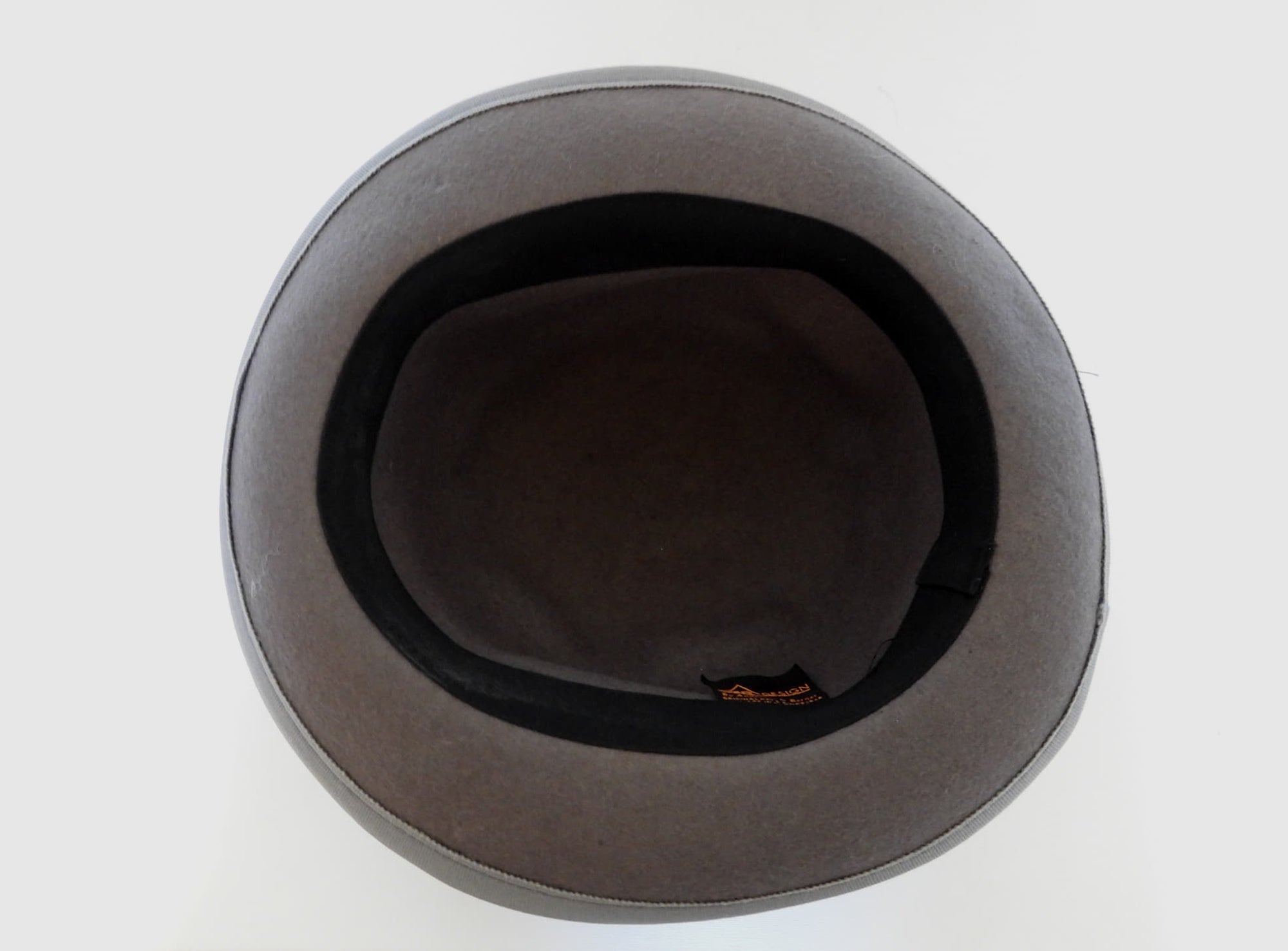 Felted bowler style black hat with grey grosgrain hatband and brim binding. Wear it bowler style with the brim up or turn the brim down for a bit of sass. Made in Denmark for Andersen &amp; Berner. 1980s??
