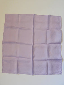 Large lavender coloured pocket handkerchief for adding just a touch of colour to your suit. The hanky has woven borders and hand rolled edges. The colour is very pale, not like the close ups. Pure silk. Made in England and marked Macclesfield Silk with an embroidered label.