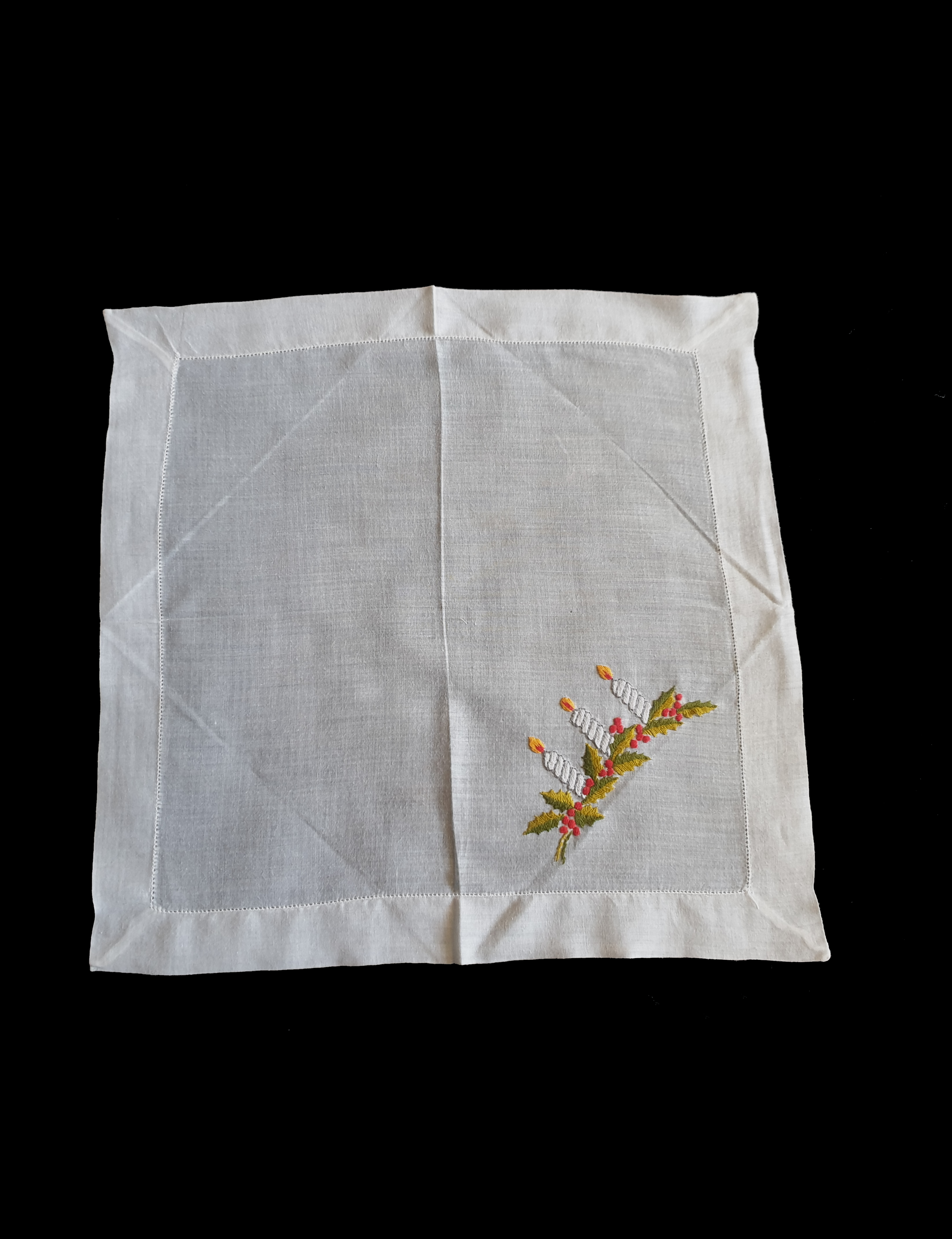Beautiful hand embroidered Christmas handkerchief, probably made as a Christmas present at least 70 years ago. Three candles and holly leaves beautifully worked on this very fine cotton batiste hanky. If you look at the reverse side in the last photo, it's almost as neat as the front, a sign of superior needlework. The edges have been hem stitched and spoke stitched. 1950s or older.