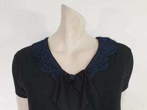 1960s vintage black mini dress with blue glitter neckline