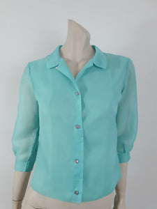1960s vintage aqua blouse with three quarter sleeves by contessa