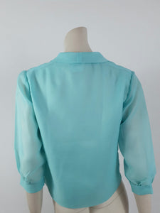 1960s vintage aqua blouse with three quarter sleeves by contessa