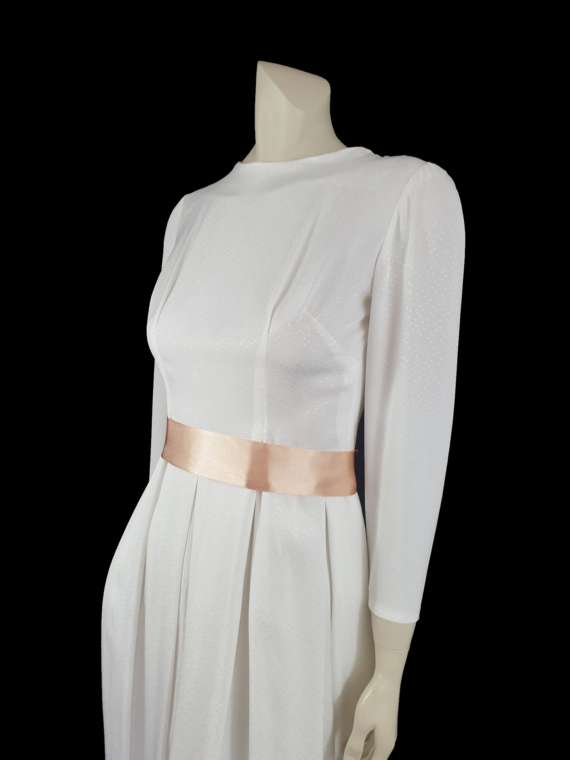 1960s white long sleeved dress with pleated skirt