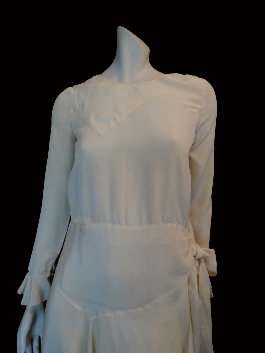 vintage 1920s cream silk dress with asymmetric hem and long sleeves