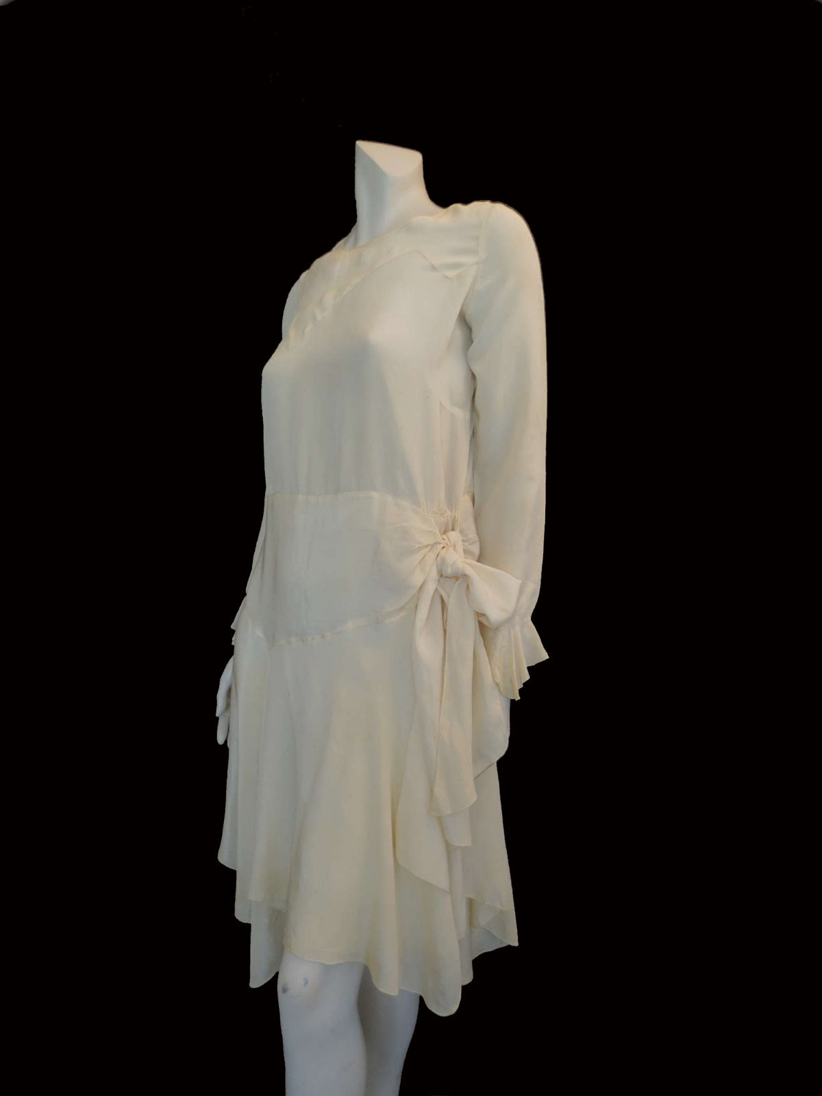vintage 1920s cream silk dress with asymmetric hem and long sleeves